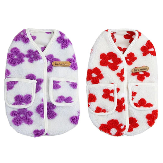 The image displays two cozy Floral Fleece Dog Vest, one adorned with purple flowers on a white background, and the other with red flowers, also on a white background.