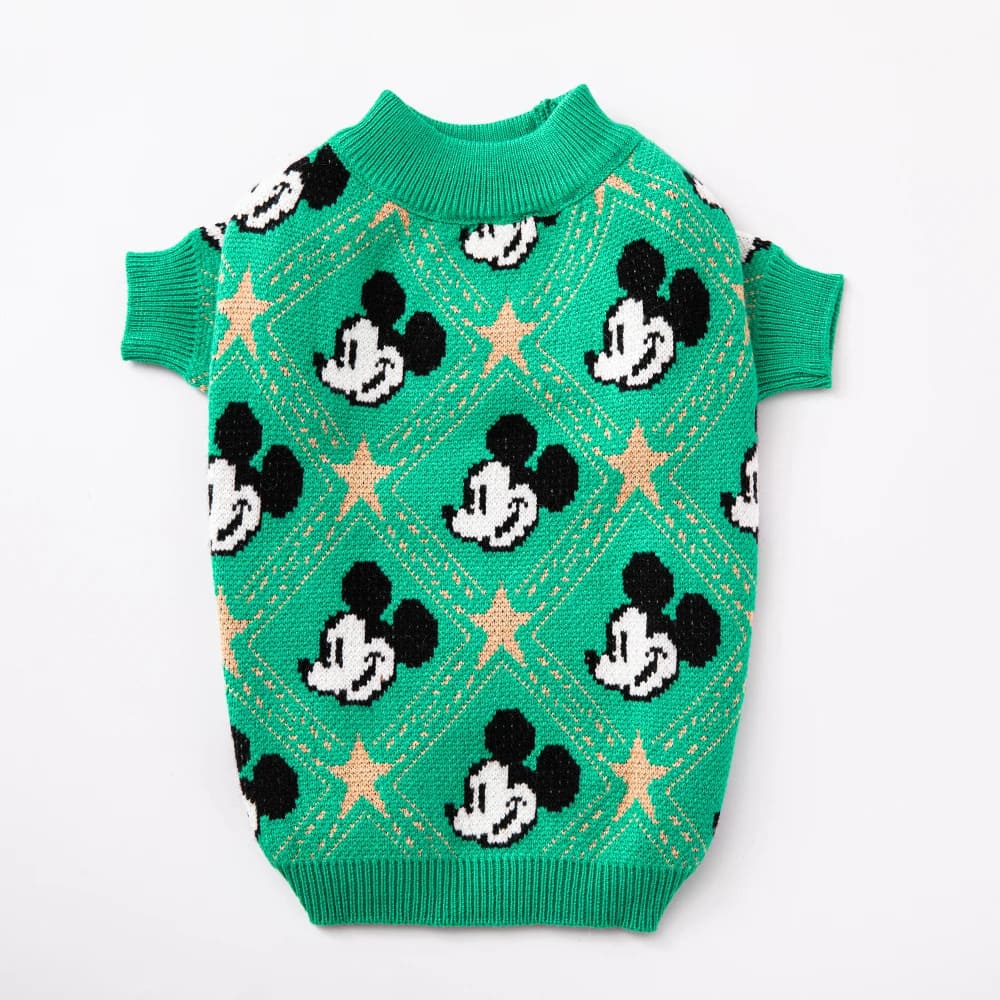 A vibrant green puppy sweater features a charming Mickey Mouse pattern with golden stars. This green chic pup fashion piece combines classic Disney charm with modern pet fashion.