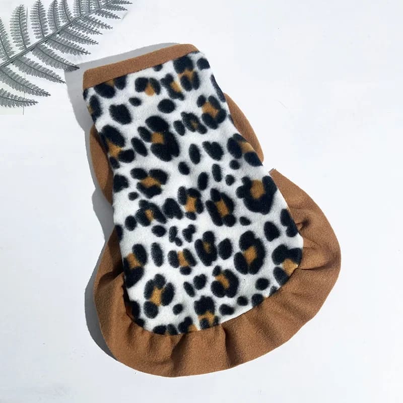 Soft fleece dog jacket featuring a leopard print design with a cozy brown trim, ideal for keeping your pooch warm.